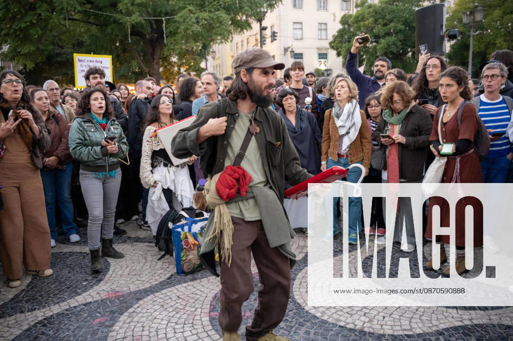 Demonstrators take part in a protest organized by the Acampada de Lisboa housing movement, demanding affordable housing, limits on rising rents and an end to property speculation. The march takes place in central Lisbon, from Marques de Pombal to Rossio Square, following recent police removal of protest tents and the detention of 55 demonstrators during housing protests in the Portuguese capital. Lisbon Portugal - ZUMAr238 20261024_zip_r238_085