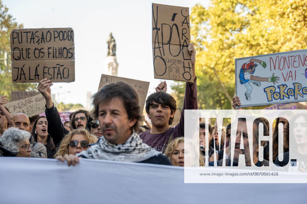 Demonstrators take part in a protest organized by the Acampada de Lisboa housing movement, demanding affordable housing, limits on rising rents and an end to property speculation. The march takes place in central Lisbon, from Marques de Pombal to Rossio Square, following recent police removal of protest tents and the detention of 55 demonstrators during housing protests in the Portuguese capital. Lisbon Portugal - ZUMAr238 20261024_zip_r238_031