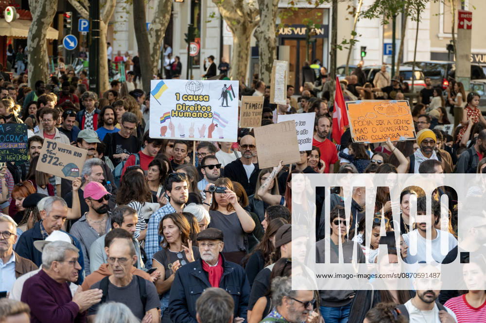 Demonstrators take part in a protest organized by the Acampada de Lisboa housing movement, demanding affordable housing, limits on rising rents and an end to property speculation. The march takes place in central Lisbon, from Marques de Pombal to Rossio Square, following recent police removal of protest tents and the detention of 55 demonstrators during housing protests in the Portuguese capital. Lisbon Portugal - ZUMAr238 20261024_zip_r238_033