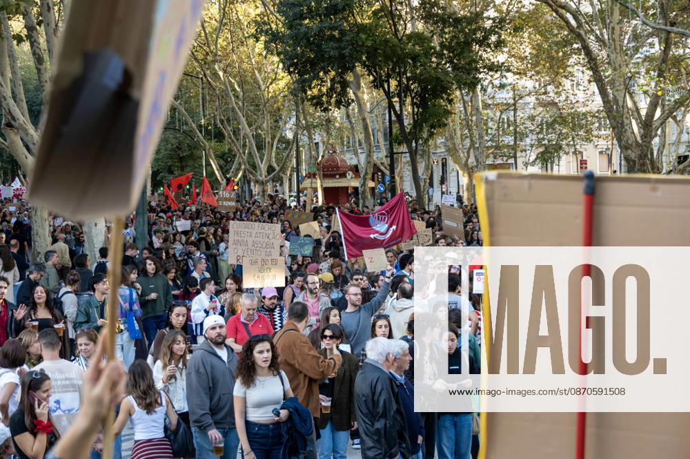 Demonstrators take part in a protest organized by the Acampada de Lisboa housing movement, demanding affordable housing, limits on rising rents and an end to property speculation. The march takes place in central Lisbon, from Marques de Pombal to Rossio Square, following recent police removal of protest tents and the detention of 55 demonstrators during housing protests in the Portuguese capital. Lisbon Portugal - ZUMAr238 20261024_zip_r238_034