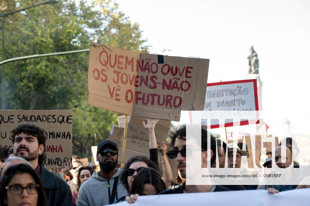 Demonstrators take part in a protest organized by the Acampada de Lisboa housing movement, demanding affordable housing, limits on rising rents and an end to property speculation. The march takes place in central Lisbon, from Marques de Pombal to Rossio Square, following recent police removal of protest tents and the detention of 55 demonstrators during housing protests in the Portuguese capital. Lisbon Portugal - ZUMAr238 20261024_zip_r238_037