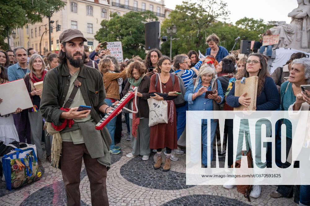 Demonstrators take part in a protest organized by the Acampada de Lisboa housing movement, demanding affordable housing, limits on rising rents and an end to property speculation. The march takes place in central Lisbon, from Marques de Pombal to Rossio Square, following recent police removal of protest tents and the detention of 55 demonstrators during housing protests in the Portuguese capital. Lisbon Portugal - ZUMAr238 20261024_zip_r238_042