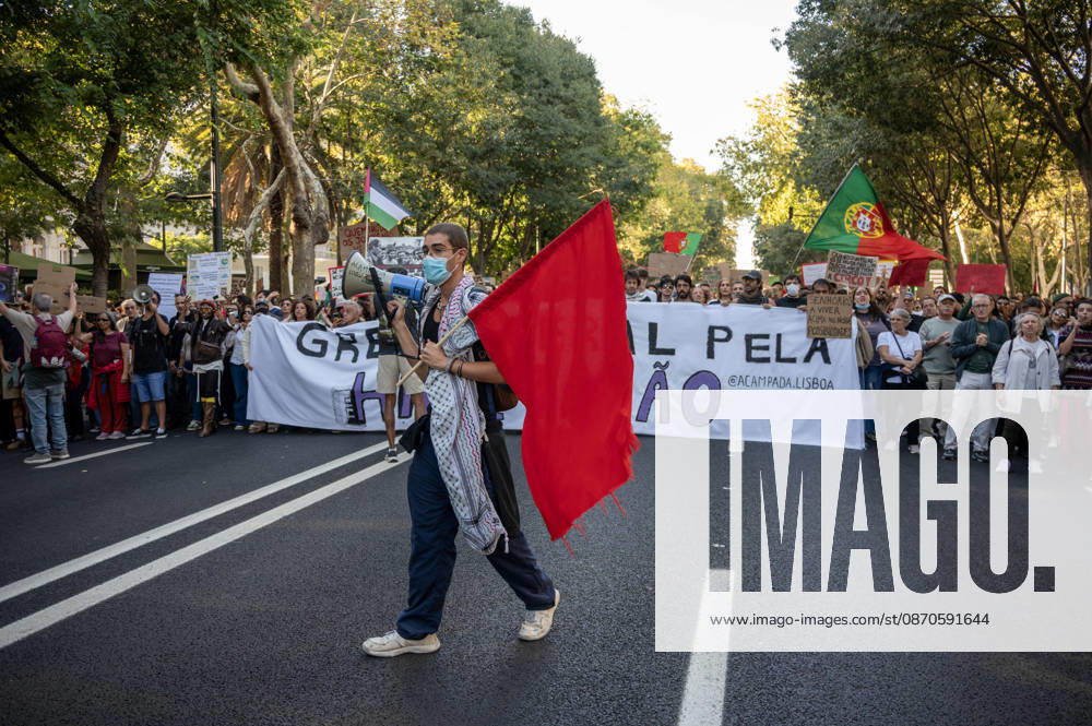 Demonstrators take part in a protest organized by the Acampada de Lisboa housing movement, demanding affordable housing, limits on rising rents and an end to property speculation. The march takes place in central Lisbon, from Marques de Pombal to Rossio Square, following recent police removal of protest tents and the detention of 55 demonstrators during housing protests in the Portuguese capital. Lisbon Portugal - ZUMAr238 20261024_zip_r238_044