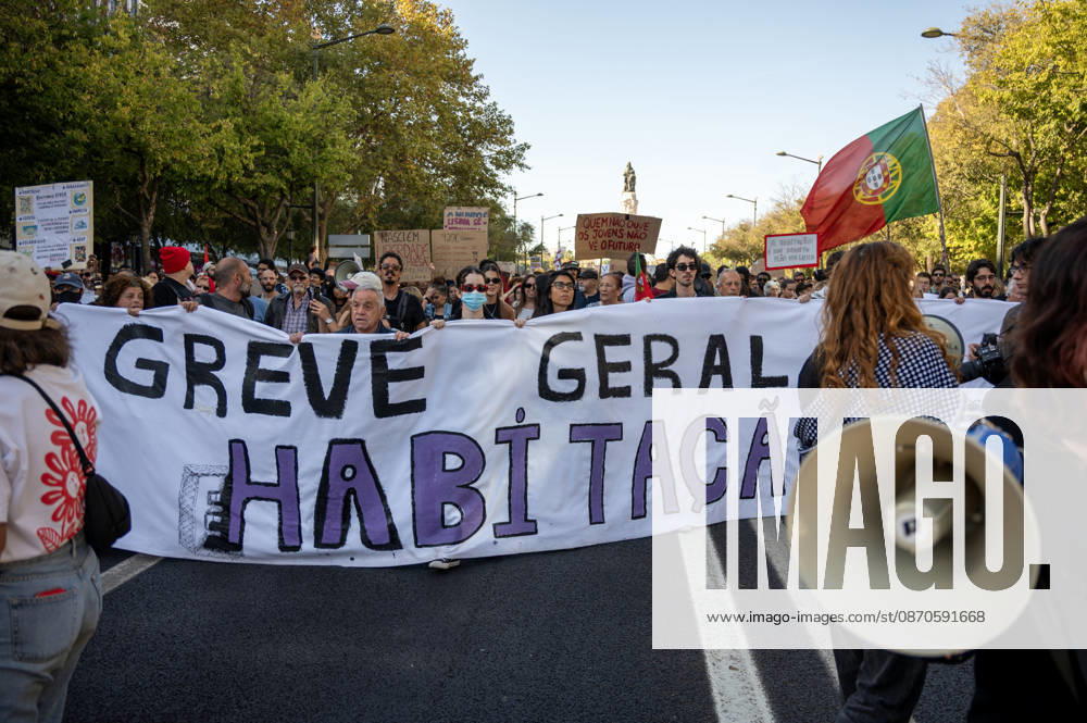 Demonstrators take part in a protest organized by the Acampada de Lisboa housing movement, demanding affordable housing, limits on rising rents and an end to property speculation. The march takes place in central Lisbon, from Marques de Pombal to Rossio Square, following recent police removal of protest tents and the detention of 55 demonstrators during housing protests in the Portuguese capital. Lisbon Portugal - ZUMAr238 20261024_zip_r238_046
