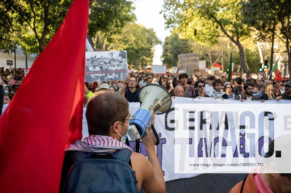 Demonstrators take part in a protest organized by the Acampada de Lisboa housing movement, demanding affordable housing, limits on rising rents and an end to property speculation. The march takes place in central Lisbon, from Marques de Pombal to Rossio Square, following recent police removal of protest tents and the detention of 55 demonstrators during housing protests in the Portuguese capital. Lisbon Portugal - ZUMAr238 20261024_zip_r238_053