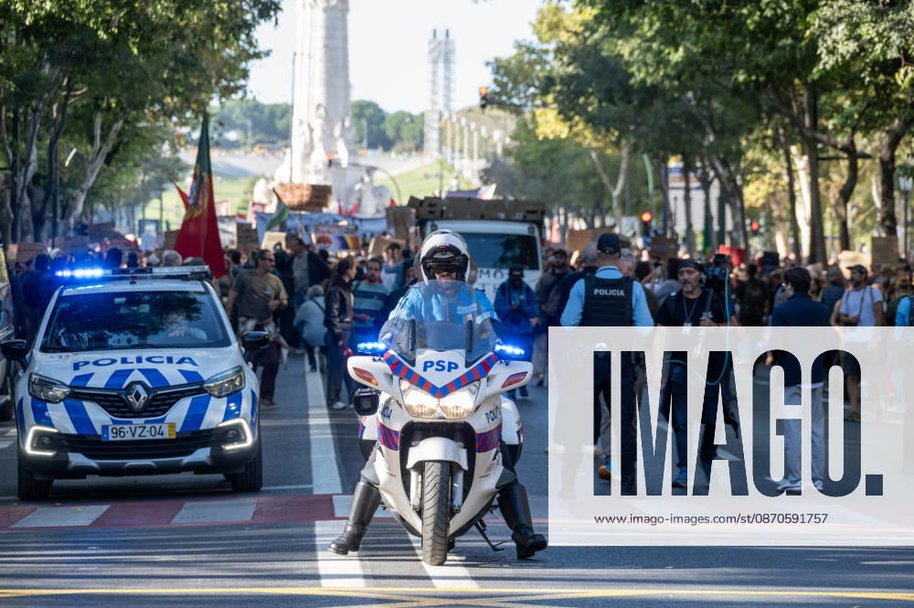 Demonstrators take part in a protest organized by the Acampada de Lisboa housing movement, demanding affordable housing, limits on rising rents and an end to property speculation. The march takes place in central Lisbon, from Marques de Pombal to Rossio Square, following recent police removal of protest tents and the detention of 55 demonstrators during housing protests in the Portuguese capital. Lisbon Portugal - ZUMAr238 20261024_zip_r238_058