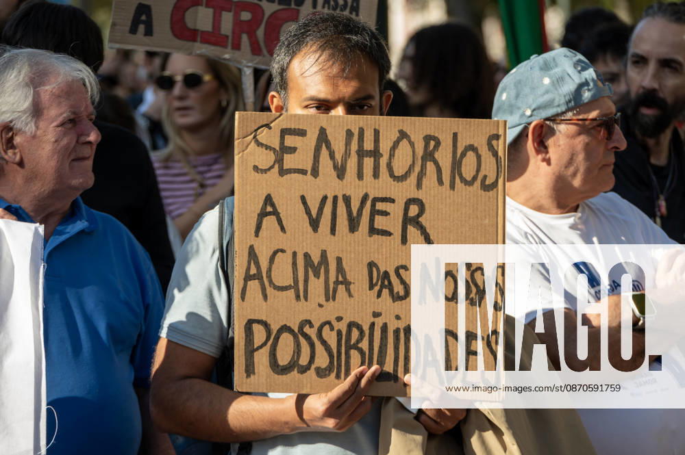 Demonstrators take part in a protest organized by the Acampada de Lisboa housing movement, demanding affordable housing, limits on rising rents and an end to property speculation. The march takes place in central Lisbon, from Marques de Pombal to Rossio Square, following recent police removal of protest tents and the detention of 55 demonstrators during housing protests in the Portuguese capital. Lisbon Portugal - ZUMAr238 20261024_zip_r238_059