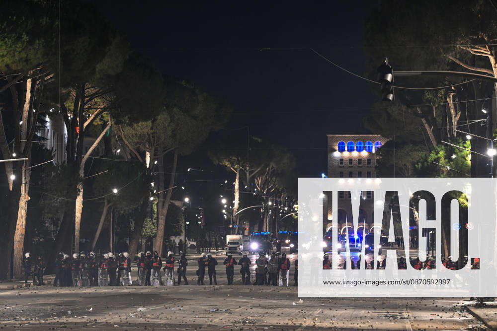 Mass Anti-Government National Protest in Tirana TIRANA, ALBANIA - OCTOBER 24: A long line of riot police officers completely blocks a massive tree-lined boulevard backed by multiple flashing police vehicles at night near the Prime Minister Office, on October 24, 2026, in Tirana, Albania. Unrest and physical confrontations erupt in Tirana city center as demonstrators and riot police clash during a massive nationwide protest, turning the capital s main avenue into a major flashpoint as chaotic skirmishes broke out between security forces and factions of the crowd. Artur Widak Anadolu Tirana Albania. Editorial use only. Please get in touch for any other usage.