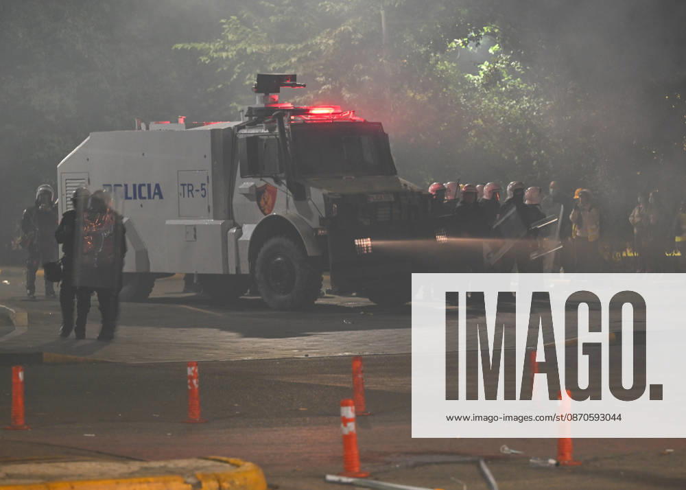 Mass Anti-Government National Protest in Tirana TIRANA, ALBANIA - OCTOBER 24: An armored police vehicle with flashing red lights remains stationed amidst dense smoke and nearby riot squads on October 24, 2026, in Tirana, Albania. Unrest and physical confrontations erupt in Tirana city center as demonstrators and riot police clash during a massive nationwide protest, turning the capital s main avenue into a major flashpoint as chaotic skirmishes broke out between security forces and factions of the crowd. Artur Widak Anadolu Tirana Albania. Editorial use only. Please get in touch for any other usage.