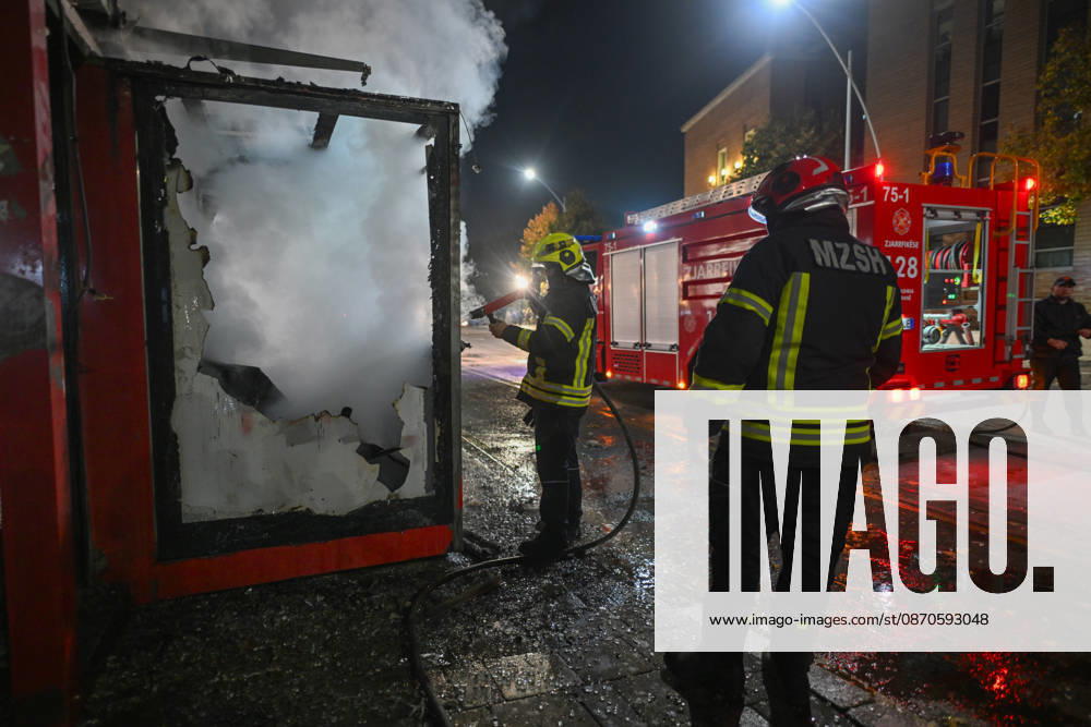 Mass Anti-Government National Protest in Tirana TIRANA, ALBANIA - OCTOBER 24: Firefighters in full protective gear spray water into a heavily damaged, smoke-filled structure next to a parked firetruck on October 24, 2026, in Tirana, Albania. Unrest and physical confrontations erupt in Tirana city center as demonstrators and riot police clash during a massive nationwide protest, turning the capital s main avenue into a major flashpoint as chaotic skirmishes broke out between security forces and factions of the crowd. Artur Widak Anadolu Tirana Albania. Editorial use only. Please get in touch for any other usage.