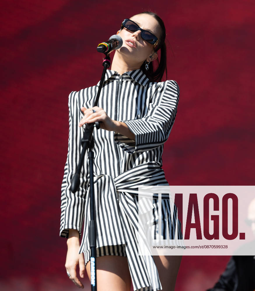 Argentine singer OLIVIA WALD performs live on stage during the Tecate Peninsula 2026 music festival at Explanada Estadio Caliente in Tijuana, Baja California, Mexico, October 24, 2026. She wears a striped black-and-white outfit and sunglasses while singing at the microphone. Tijuana Mexico - ZUMAm311 20261024_zip_m311_001