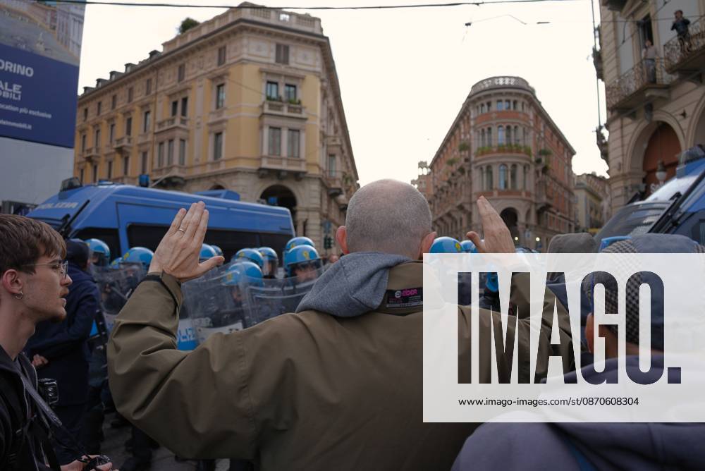 Turin Protesters Clash With Police TURIN, ITALY, OCTOBER 24, 2026: Riot police use water cannons and tear gas during confrontations with demonstrators protesting against military rearmament, rising living costs and government policies in Turin. The march begins in Piazza Castello before moving towards northern districts, with clashes occurring as police block protesters from entering streets leading towards the city centre. Turin IT