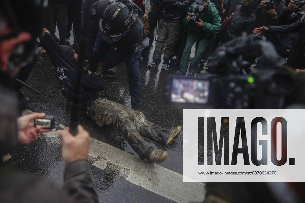 Paris Street Protest Police officers detain a demonstrator during unrest in Paris, France on October 24, 2026. Authorities deployed around 70,000 security personnel across France for renewed protests over the cost of living on October 24, after unrest a week earlier saw public buildings vandalized, hundreds of shops looted and about 2,700 people arrested. Paris Ile de France France