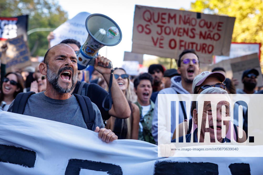 Protesters shout slogans during the demonstration. People march through central Lisbon during a demonstration demanding affordable housing and protesting against the rising cost of living. The protest started at Marques de Pombal and ended at Rossio Square, where demonstrators set up tents at the end of the march in protest against Portugal s housing crisis. Lisbon Portugal - ZUMAs197 20261024_aaa_s197_595