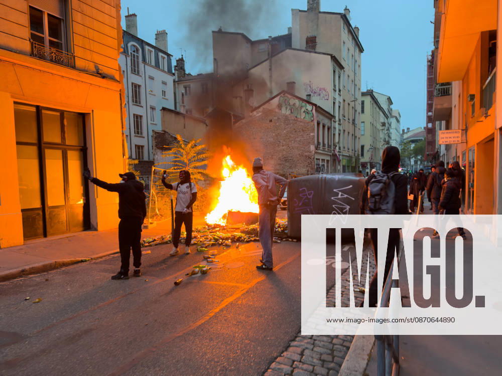 Lyon France Protests October 24 Demonstrators stand near a fire on a street during a protest in Lyon, France on October 24, 2026. Authorities deployed around 70,000 security personnel across France for renewed protests over the cost of living, after unrest a week earlier saw public buildings damaged, hundreds of shops looted and about 2,700 people arrested. Lyon Rhone Alpes France