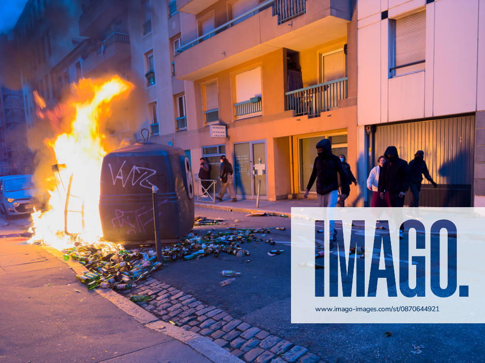 Lyon France Protests October 24 Demonstrators walk near a fire on a street during a protest in Lyon, France on October 24, 2026. Authorities deployed around 70,000 security personnel across France for renewed protests over the cost of living, after unrest a week earlier saw public buildings damaged, hundreds of shops looted and about 2,700 people arrested. Lyon Rhone Alpes France