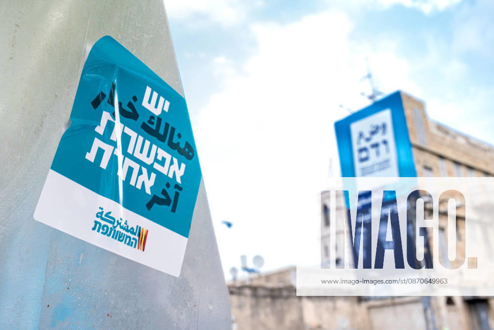 2026 Elections in Israel: Haifa, Israel, on October 24, 2026 A sticker from the United List, an alliance of Arab parties, on a road sign bearing