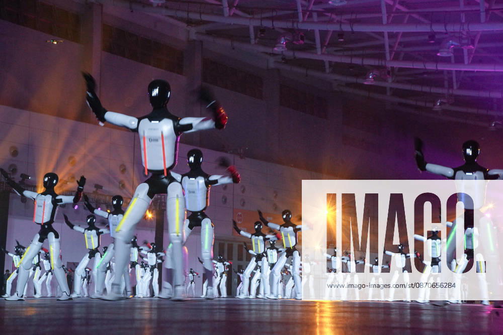 One hundred and ten domestic humanoid robots perform a synchronized dance to attempt the Guinness World Record for most robots dancing simultaneously at the Yellow River International Convention and Exhibition Center on October 24, 2026 in Jinan, Shandong Province of China.