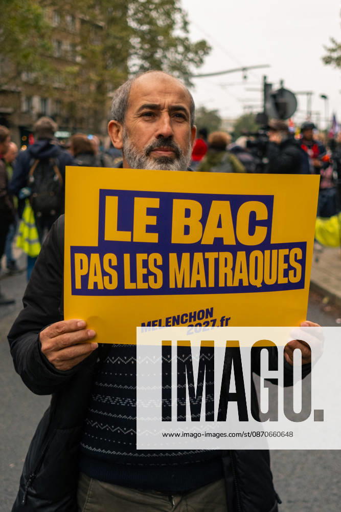 Yellow Vests Protest Act II - Paris Demonstrators carry placards displaying political messages during a march against the rising cost of living and for social justice in Paris, France, on October 24, 2026. The protest follows the boulevards des Maréchaux from Porte d’Italie to Porte de Vincennes, with calls for higher wages and better funding for public services and education. Photo by Jules Bernard ABACAPRESS.COM Paris Île-de-France France
