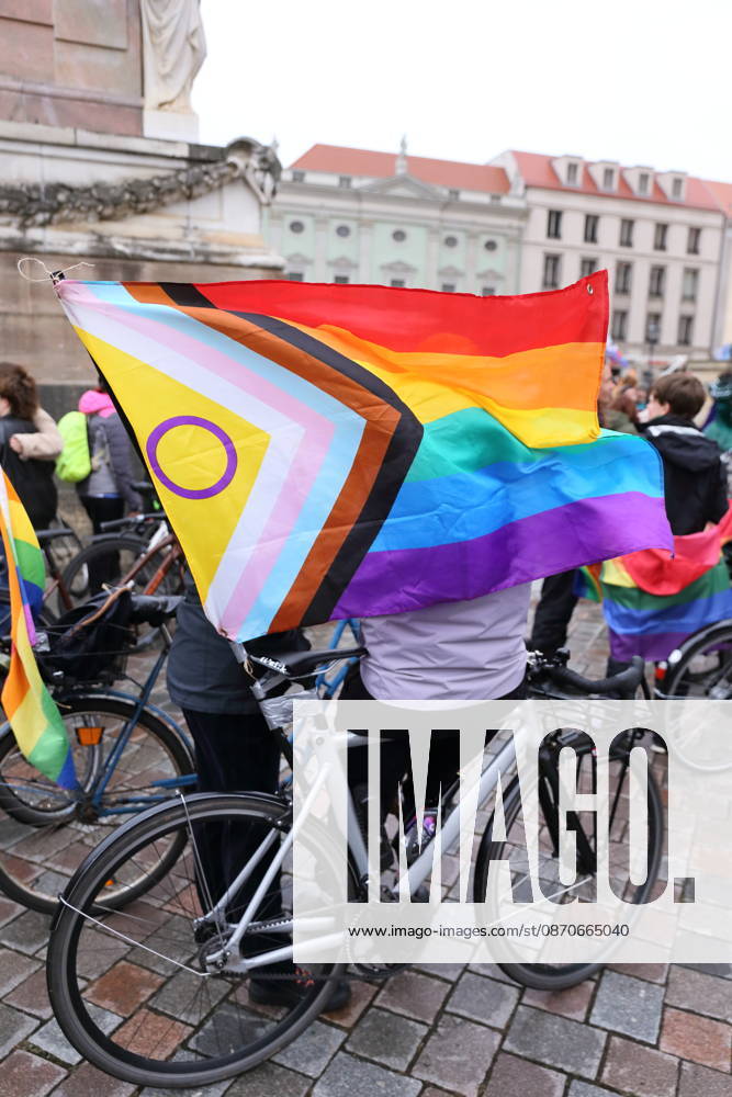 Protesters stand with a rainbow flag on the Alter Markt during Bike Pride in Potsdam, October 24, 2026 Bike Pride Potsdam