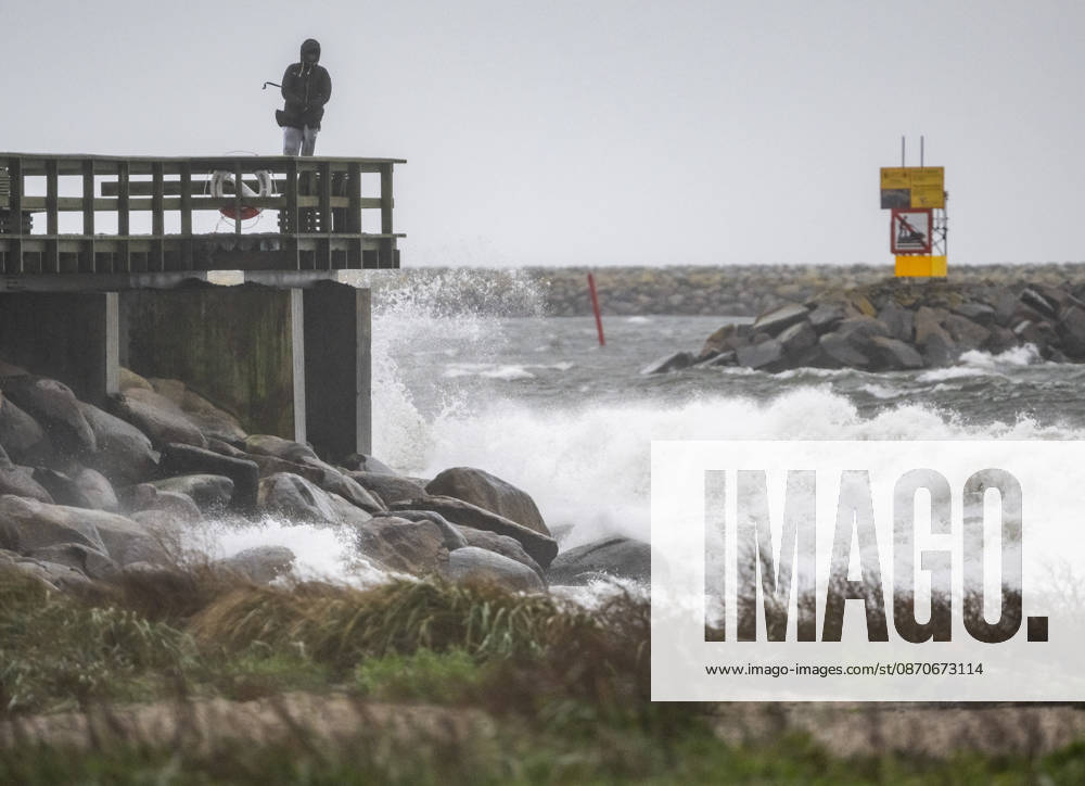YSTAD, October 25, 2026: Storm watchers on the swimming pier at the small boat harbor in Ystad amid strong winds as Storm Boelo swept across southern Sweden on Sunday. YSTAD, SWEDEN
