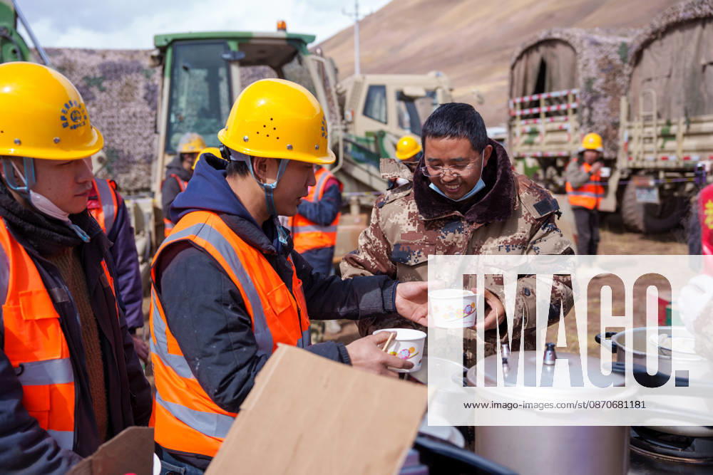 (261025) -- BAQEN, Oct. 25, 2026 -- Du Guoping (R) distributes dumplings to rescuers at a temporary shelter in Maru Township of Baqen County, Nagqu City, southwest China s Xizang Autonomous Region, Oct. 24, 2026. After a 7.0-magnitude earthquake struck Baqen County in Nagqu, southwest China s Xizang Autonomous Region, on Thursday, Du Guoping, owner of a dumpling restaurant in Xigaze, postponed the opening of his two new restaurants and headed to the disaster zone with his staff. It took only about 10 minutes to make the decision that we would go to Baqen and cook dumplings for earthquake-affected residents, Du said. The team loaded more than 1,500 kilograms of dumplings onto vehicles and set off from Xigaze at midnight on the night o