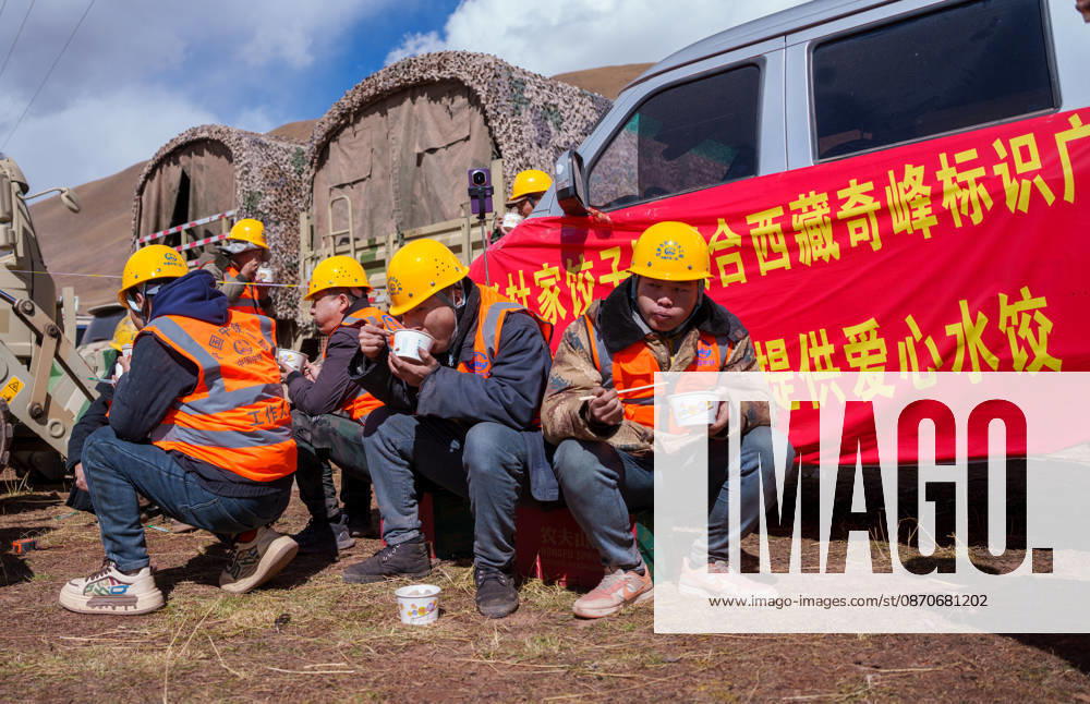(261025) -- BAQEN, Oct. 25, 2026 -- Rescuers eat dumplings at a temporary shelter in Maru Township of Baqen County, Nagqu City, southwest China s Xizang Autonomous Region, Oct. 24, 2026. After a 7.0-magnitude earthquake struck Baqen County in Nagqu, southwest China s Xizang Autonomous Region, on Thursday, Du Guoping, owner of a dumpling restaurant in Xigaze, postponed the opening of his two new restaurants and headed to the disaster zone with his staff. It took only about 10 minutes to make the decision that we would go to Baqen and cook dumplings for earthquake-affected residents, Du said. The team loaded more than 1,500 kilograms of dumplings onto vehicles and set off from Xigaze at midnight on the night of the earthquake. Upon