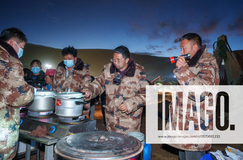 (261025) -- BAQEN, Oct. 25, 2026 -- Du Guoping (2nd R) checks a pressure cooker at a temporary shelter in Maru Township of Baqen County, Nagqu City, southwest China s Xizang Autonomous Region, Oct. 24, 2026. After a 7.0-magnitude earthquake struck Baqen County in Nagqu, southwest China s Xizang Autonomous Region, on Thursday, Du Guoping, owner of a dumpling restaurant in Xigaze, postponed the opening of his two new restaurants and headed to the disaster zone with his staff. It took only about 10 minutes to make the decision that we would go to Baqen and cook dumplings for earthquake-affected residents, Du said. The team loaded more than 1,500 kilograms of dumplings onto vehicles and set off from Xigaze at midnight on the night of the