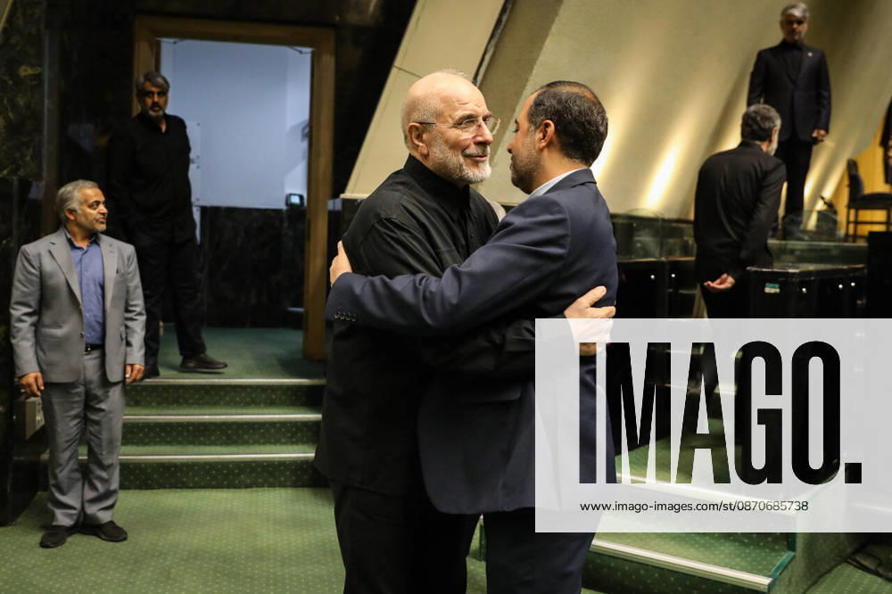 Mohammad Bagher Ghalibaf embraces a man in a navy suit beside the steps of the parliament chamber at the Islamic Consultative Assembly in Tehran, Iran, on October 25, 2026. Speaker Mohammad Bagher Ghalibaf chaired the October 25 session, which combined physical attendance at the Islamic Consultative Assembly with participation by video link. Tehran Iran - ZUMAi98_ 20261025_zih_i98_042