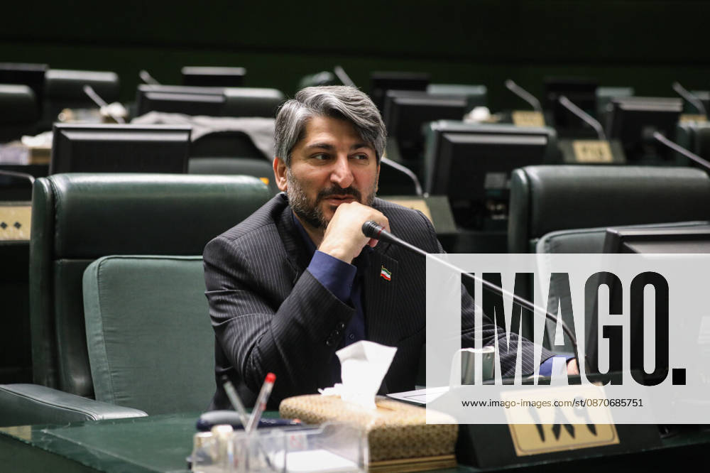 An Iranian lawmaker speaks into a desk microphone from a numbered seat in the Islamic Consultative Assembly at the Islamic Consultative Assembly in Tehran, Iran, on October 25, 2026. Parliamentary reports said more than two-thirds of lawmakers joined the October 25 open sitting of the Islamic Consultative Assembly, attending either in person or remotely. Tehran Iran - ZUMAi98_ 20261025_zih_i98_048