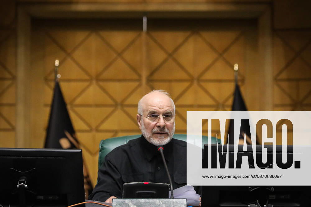 Mohammad Bagher Ghalibaf holds a sheet of paper while speaking from the speaker s chair behind two monitors at the Islamic Consultative Assembly in Tehran, Iran, on October 25, 2026. Speaker Mohammad Bagher Ghalibaf chaired the October 25 session, which combined physical attendance at the Islamic Consultative Assembly with participation by video link. Tehran Iran - ZUMAi98_ 20261025_zih_i98_087