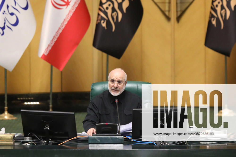 Mohammad Bagher Ghalibaf sits at the speaker s desk holding papers with Iranian flags behind him at the Islamic Consultative Assembly in Tehran, Iran, on October 25, 2026. Parliamentary reports said more than two-thirds of lawmakers joined the October 25 open sitting of the Islamic Consultative Assembly, attending either in person or remotely. Tehran Iran - ZUMAi98_ 20261025_zih_i98_109