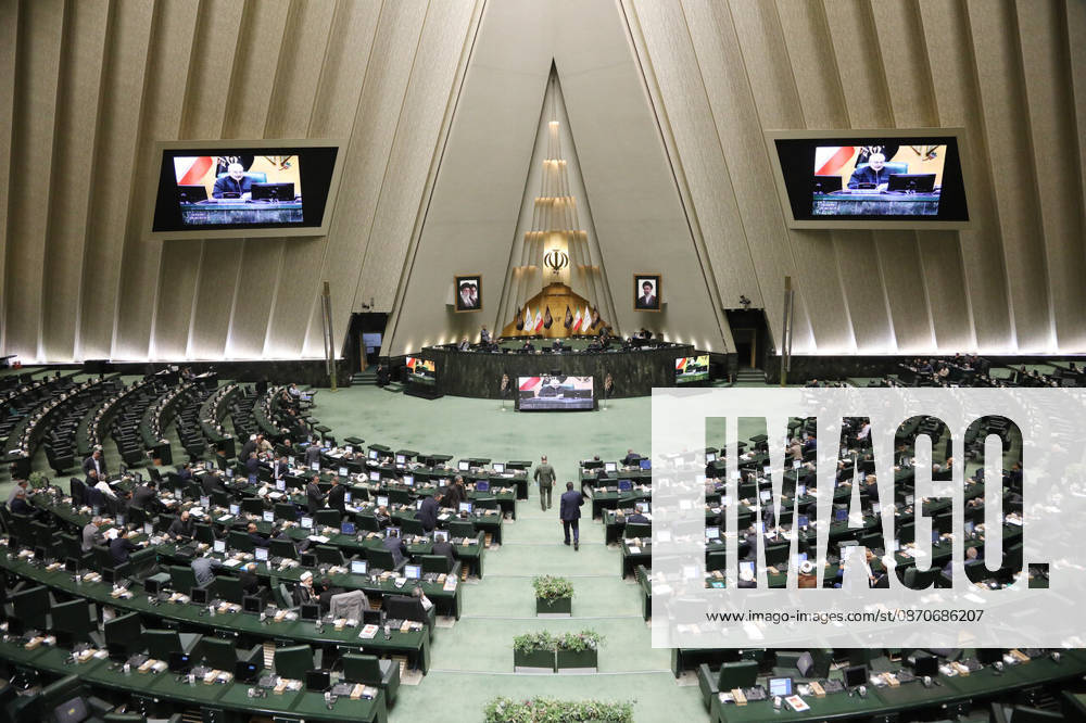 A very wide view of the parliamentary chamber shows hundreds of green seats, the front dais and two suspended video screens at the Islamic Consultative Assembly in Tehran, Iran, on October 25, 2026. Parliamentary reports said more than two-thirds of lawmakers joined the October 25 open sitting of the Islamic Consultative Assembly, attending either in person or remotely. Tehran Iran - ZUMAi98_ 20261025_zih_i98_124