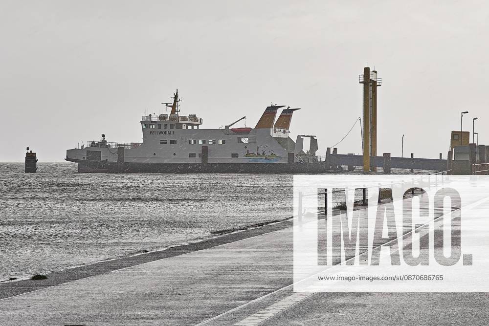 Pellworm, Schleswig-Holstein, Germany, October 25, 2026: Storm on the North Sea; the Pellworm I ferry at the deep-water pier