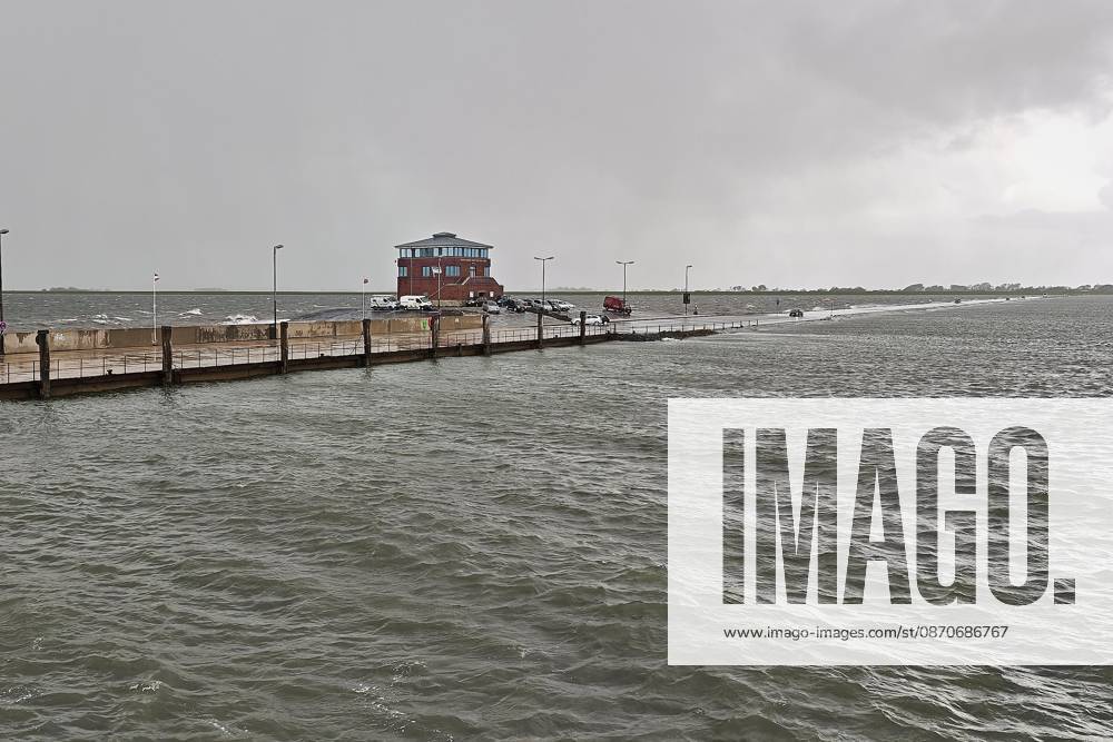 Pellworm, Schleswig-Holstein, Germany, October 25, 2026: Storm on the North Sea; deep-water pier with the Rungholt Tower