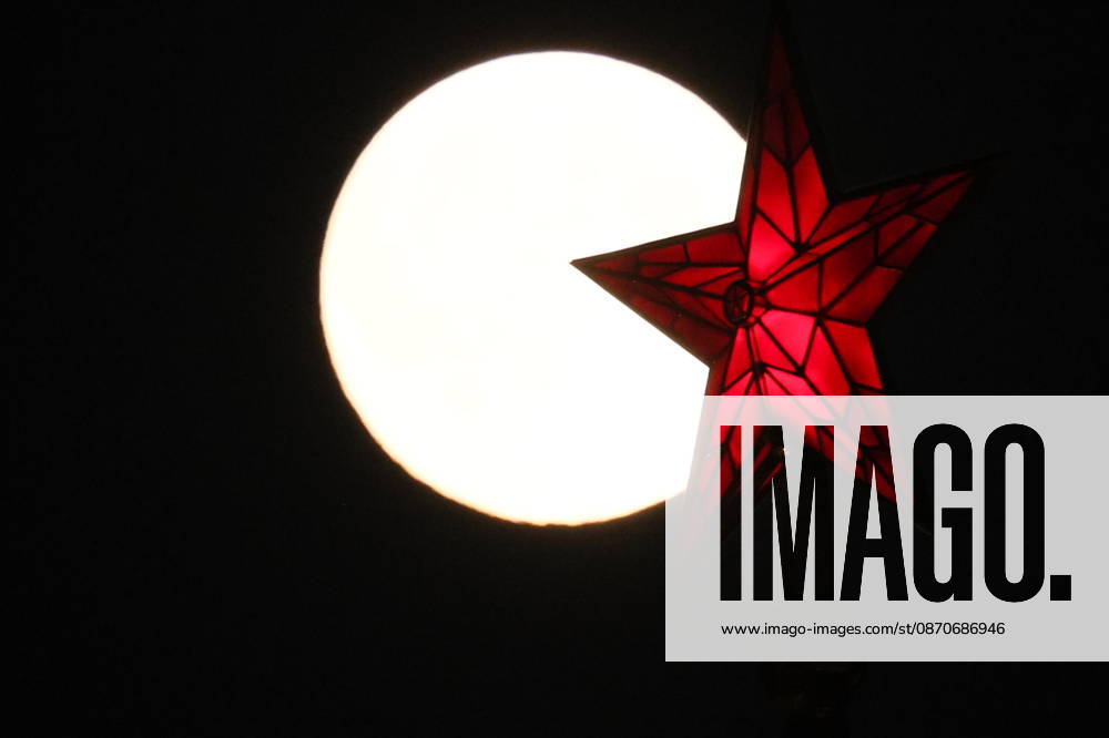 RUSSIA, MOSCOW - OCTOBER 25, 2026: A red star atop a tower of the Moscow Kremlin is silhouetted against the full moon shining over the city. Sergei Savostyanov TASS 99951607