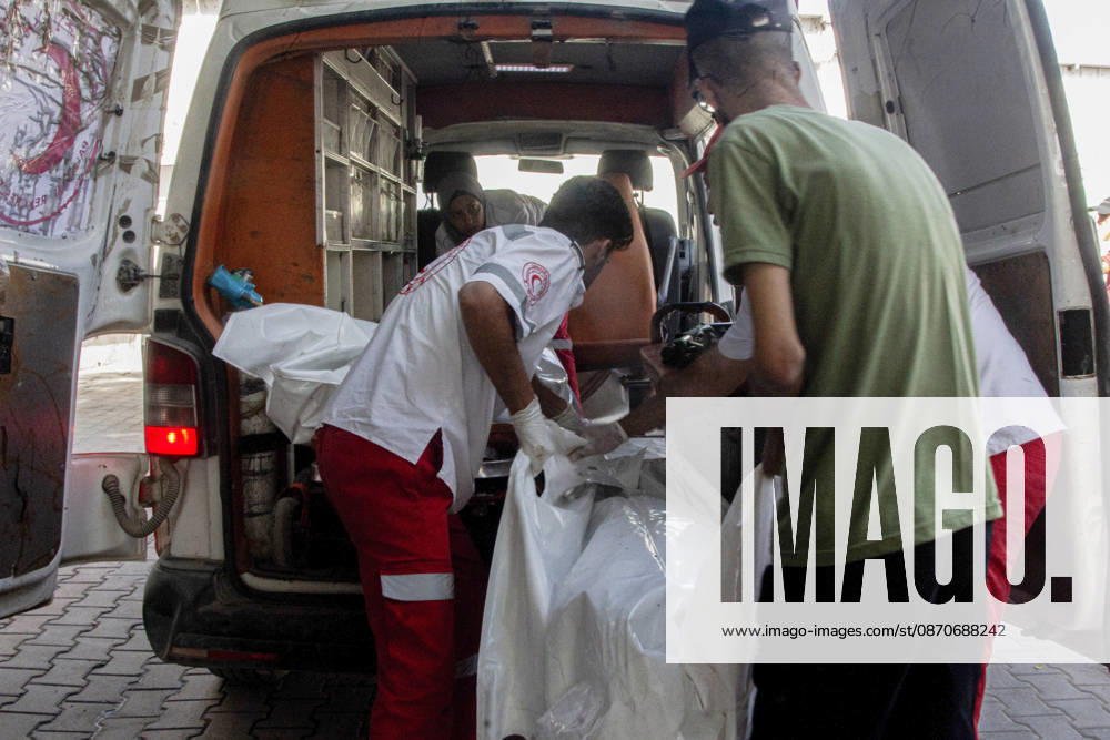 Gaza Israeli University Strike 2026 Palestinian emergency workers handle white body bags at the back of an ambulance ahead of funerals in Gaza City, Palestine, on October 25, 2026. According to information provided by local sources, three Islamic University guards, Ashraf Dahlan, Shadi Abu Ataya and Sami Baroud, were killed and others injured in an Israeli strike on the university campus in western Gaza City. Palestinian media reported that a second drone strike hit the campus after an earlier attack injured several people and prompted the university to suspend activities. Gaza Gaza Strip Palestinian Territories