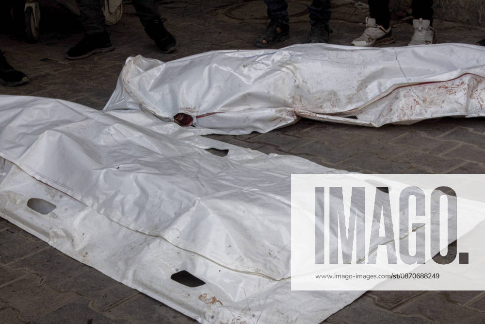 Gaza Israeli University Strike 2026 White body bags containing the remains of Palestinians killed in a reported Israeli strike lie on the ground ahead of funerals in Gaza City, Palestine, on October 25, 2026. According to information provided by local sources, three Islamic University guards, Ashraf Dahlan, Shadi Abu Ataya and Sami Baroud, were killed and others injured in an Israeli strike on the university campus in western Gaza City. Palestinian media reported that a second drone strike hit the campus after an earlier attack injured several people and prompted the university to suspend activities. Gaza Gaza Strip Palestinian Territories