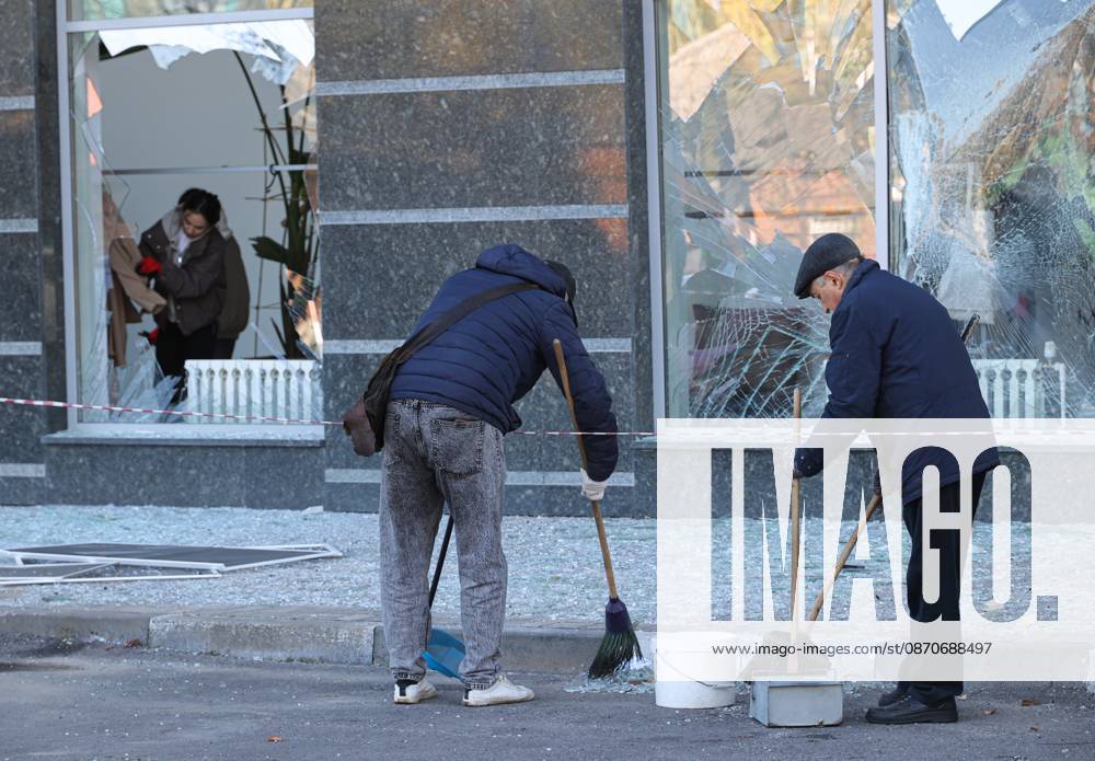 Russia Ukraine Drone Attack 9273024 25.10.2026 People clear debris outside a residential building damaged in a massive drone attack amid Russia s military operation in Ukraine, in Belgorod, Russia. Two persons were killed and 14 others were injured in a reported strike by the Ukrainian Armed Forces on October 25. Taisia Liskovets Sputnik Belgorod Russia