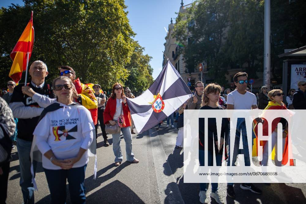 A woman waves a flag of Ceuta..Thousands of people in Madrid have rallied in support of the demands made by women from Ceuta known locally as caballas who are calling for a return to normalcy in the autonomous city. Madrid Spain - ZUMAs197 20261025_aaa_s197_117