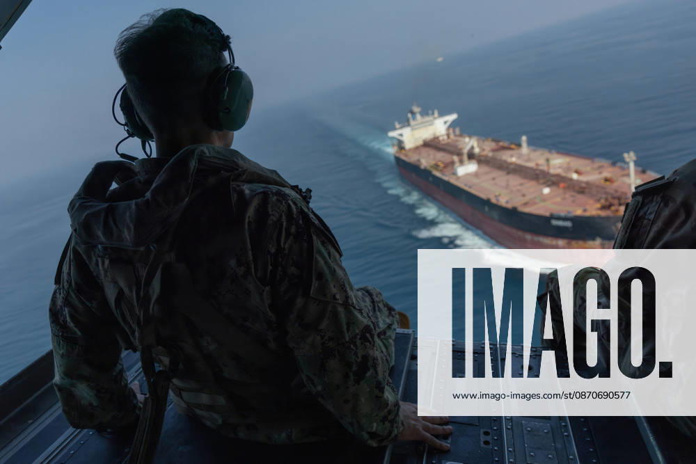 Strait Of Hormuz: Strait of Hormuz. 25 October, 2026. U.S. Navy Adm. Brad Cooper, commander of U.S. Central Command, observes a commercial vessel transiting the Strait of Hormuz from a U.S. Army CH-47 Chinook helicopter, October 25, 2026 over the Strait of Hormuz. Strait Of Hormuz - ZUMAp138 20261025_zaa_p138_062