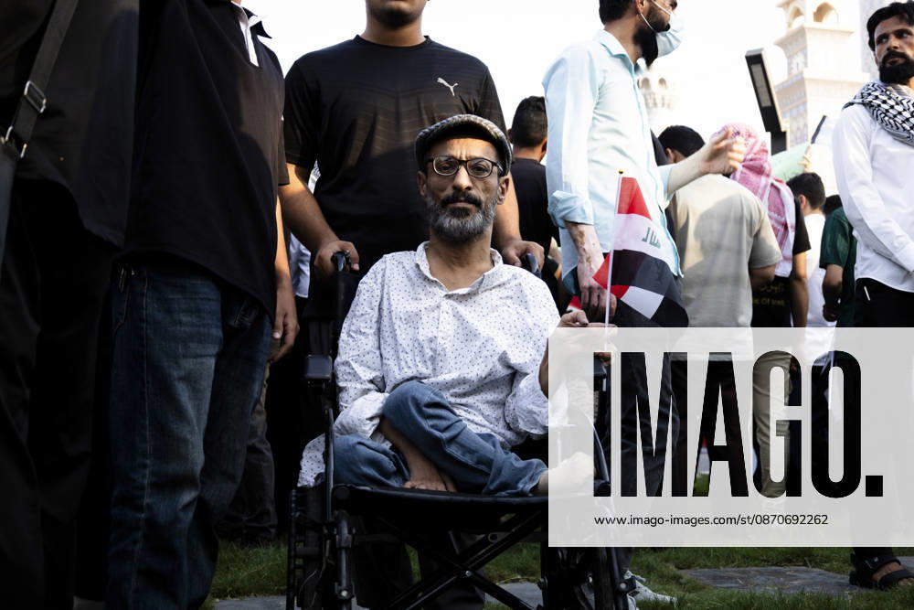 Najaf Iraq October Protest A participant sits in a wheelchair holding an Iraqi flag during a demonstration in Najaf, Iraq on October 25, 2026. The protest marked the seventh anniversary of the October 2019 protest movement, with participants calling for political reform, anti-corruption measures, improved public services and more jobs. Najaf Najaf Iraq