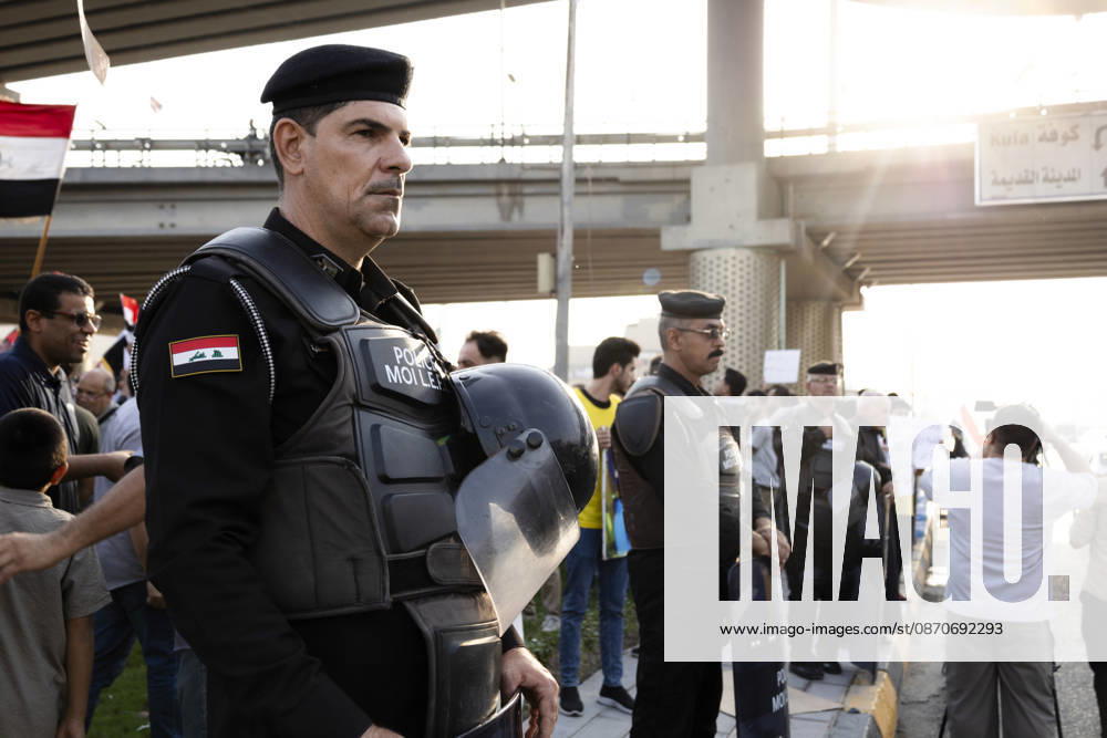 Najaf Iraq October Protest Security personnel stand along a street during a protest in Najaf, Iraq on October 25, 2026. The protest marked the seventh anniversary of the October 2019 protest movement, with participants calling for political reform, anti-corruption measures, improved public services and more jobs. Najaf Najaf Iraq