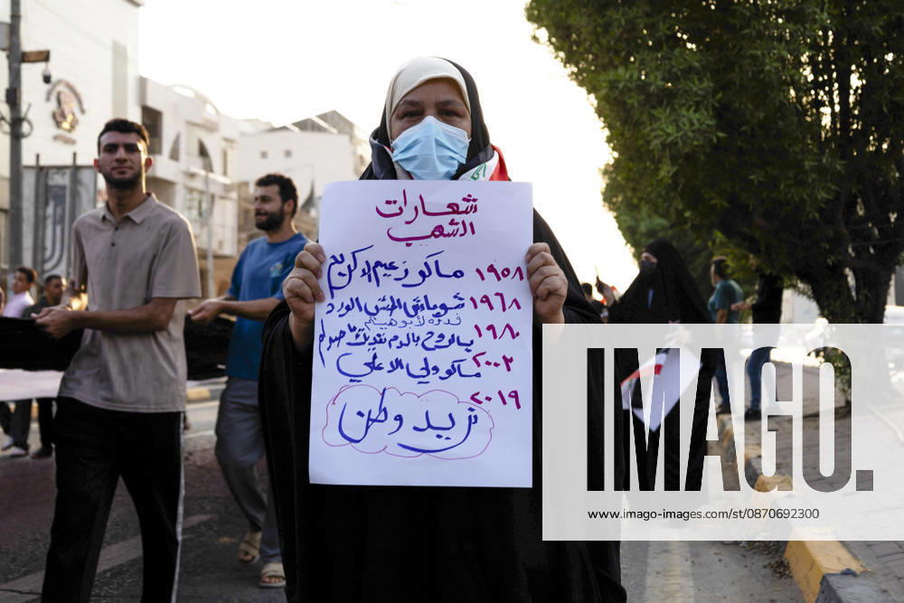 Najaf Iraq October Protest A woman holds a sign reading We Want a Homeland during a demonstration in Najaf, Iraq on October 25, 2026. The protest marked the seventh anniversary of the October 2019 protest movement, with participants calling for political reform, anti-corruption measures, improved public services and more jobs. Najaf Najaf Iraq