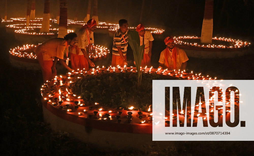 Devotees are seen near the earthen lamps on the occasion of Sharad Purnima (full moon) celebration in Mumbai. Sharad Purnima, also known as the Full Moon Festival, marks the end of the monsoon season. devotees observe fasting and meditate on the full moon night, Goddess Lakshmi, the deity of wealth, is worshipped on this day as it is believed to be her birthday. praying to her is said to bring good luck and prosperity in the life of devotees. Mumbai India - ZUMAs197 20261025_aab_s197_018
