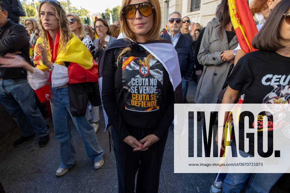 A march demanding solutions and a restoration of social normalcy in Ceuta - Madrid, Spain - 25 Oct 2026 A woman wears a T-shirt in support of the autonomous city of Ceuta. Thousands of people in Madrid have rallied in support of the demands made by women from Ceuta—known locally as caballas —who are calling for a return to normalcy in the autonomous city. Madrid Spain