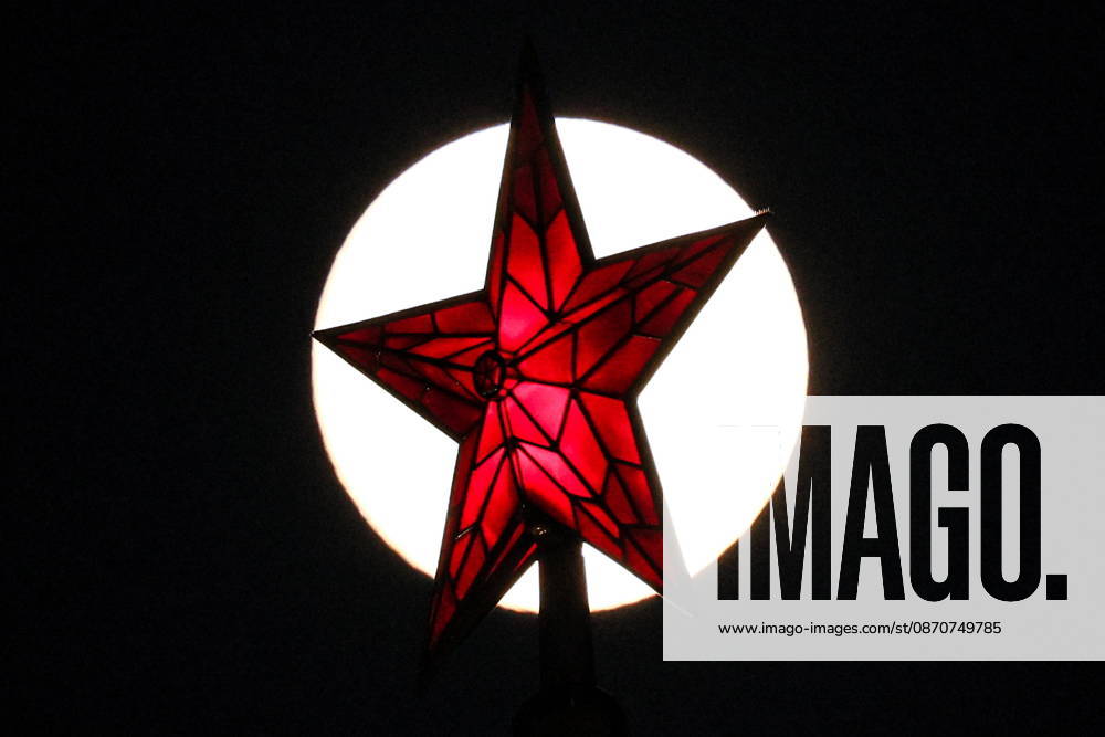 RUSSIA, MOSCOW - OCTOBER 25, 2026: A red star atop a tower of the Moscow Kremlin is silhouetted against the full moon shining over the city. Sergei Savostyanov TASS 99996162