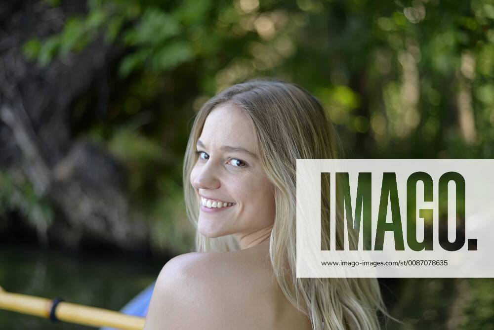 Portrait of smiling blond woman kayaking model released Symbolfoto BFRF01895