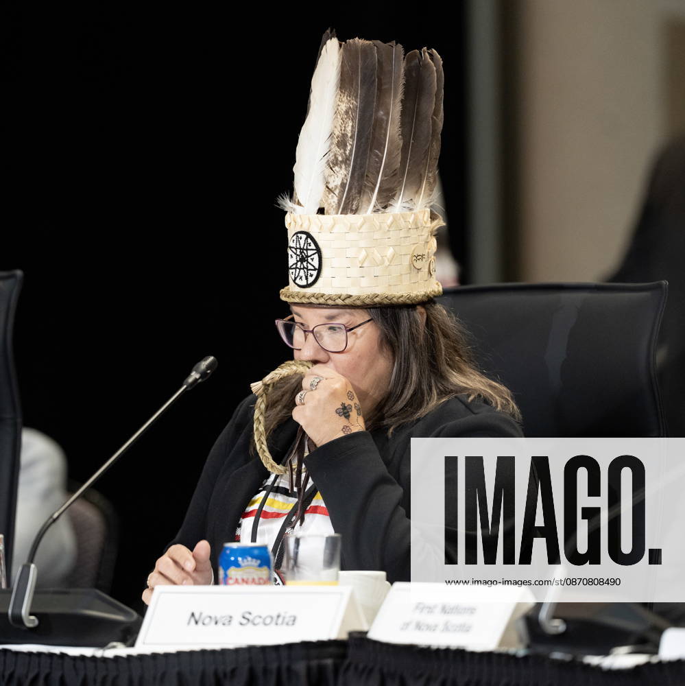 Nova Scotia Regional Chief Andrea Paul kisses a sweetgrass braid as she listens to a speaker deliver remarks at the First Nations and First Ministers meeting in Ottawa, Monday, Oct. 26, 2026. Ottawa Canada - ZUMAc35_ 20261026_zaf_c35_031