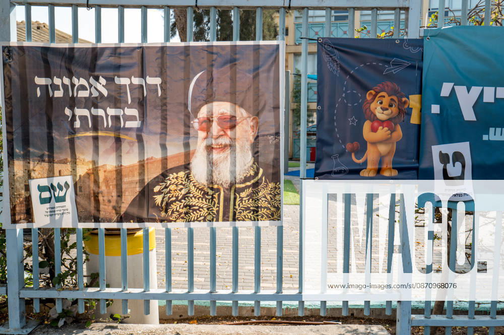 High Turnout in Israeli elections in Israel - 27 Oct 2026 A Shas party campaign banner featuring Rabbi Ovadia Yosef, the party’s founder, hangs on a fence outside a school serving as a polling station. Shas represents Israel’s Sephardic religious Jewish community. Israelis head to the polls to cast their ballots in an election widely seen as one of the most consequential in the country’s history. Voters turned out at 12 p.m. which is the highest recorded time since 1973. Ganey Tikva Israel